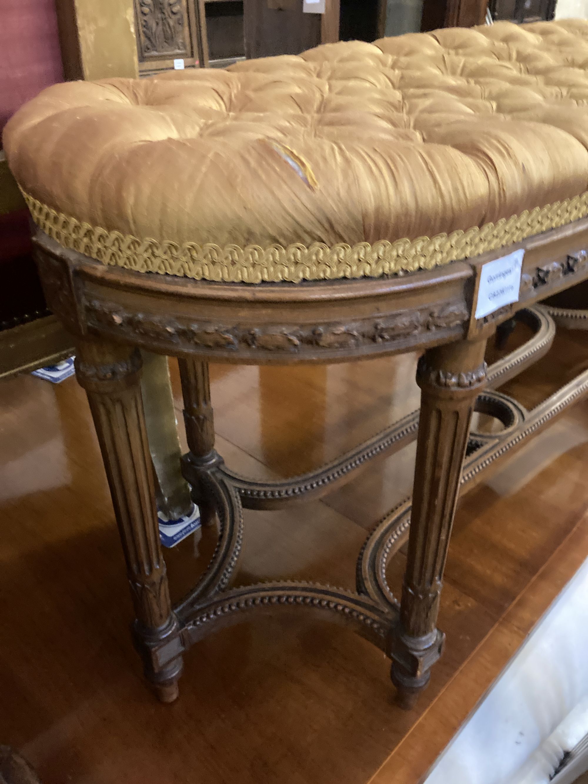 A French dressing stool, length 100cm, depth 38cm, height 52cm together with a Victorian adjustable piano stool
